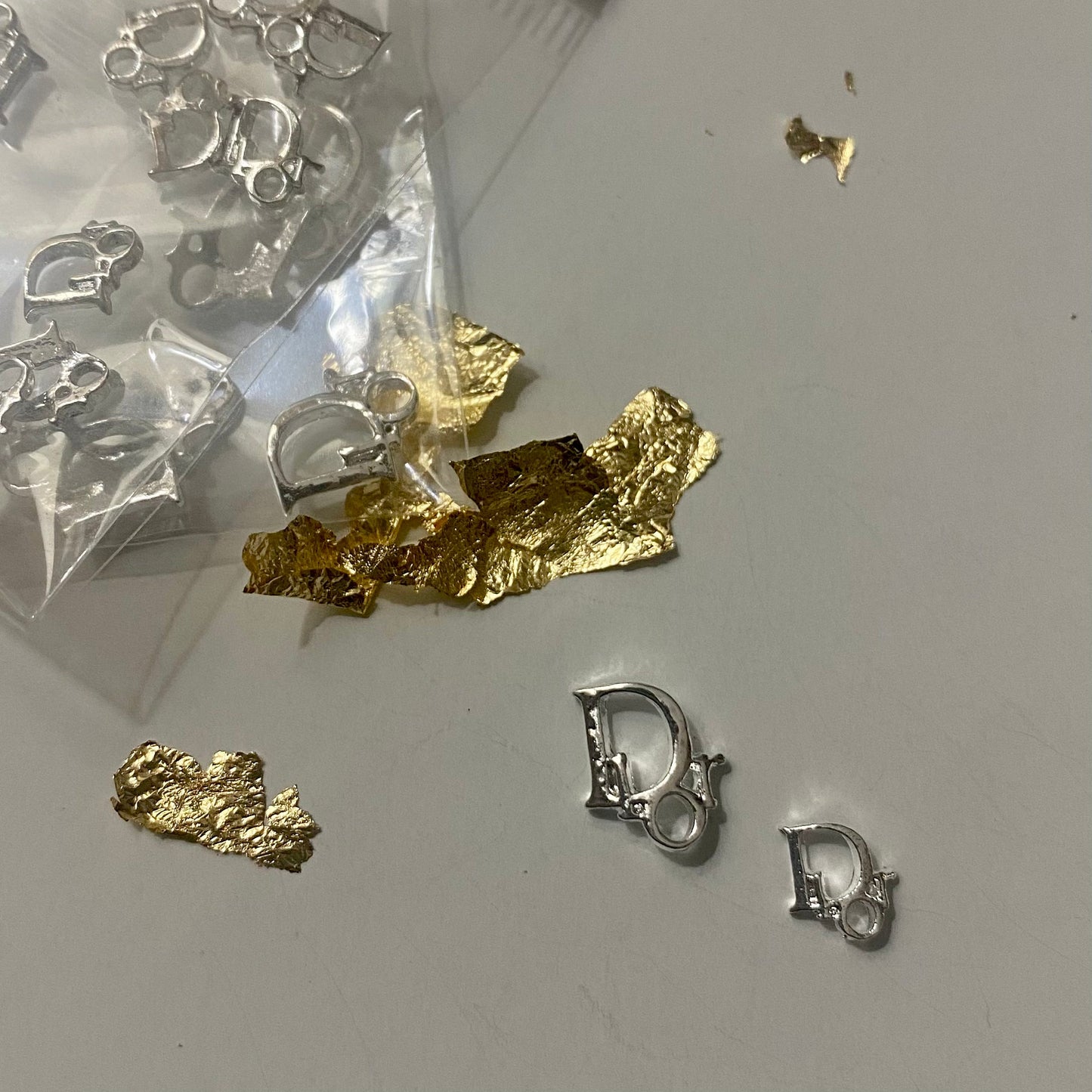 Designer D Silver Charm
